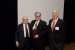 Dr. Nagib Callaos, General Chair, and Prof. Grandon Gill, Chair of the Award Ceremony, giving Prof. Ronald A. Styron a plaque "In Appreciation for Delivering a Great Keynote Address at a Plenary Session."